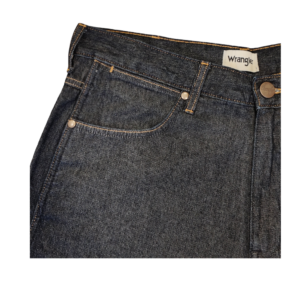 Close-up of a pair of Wrangler jeans on a white background