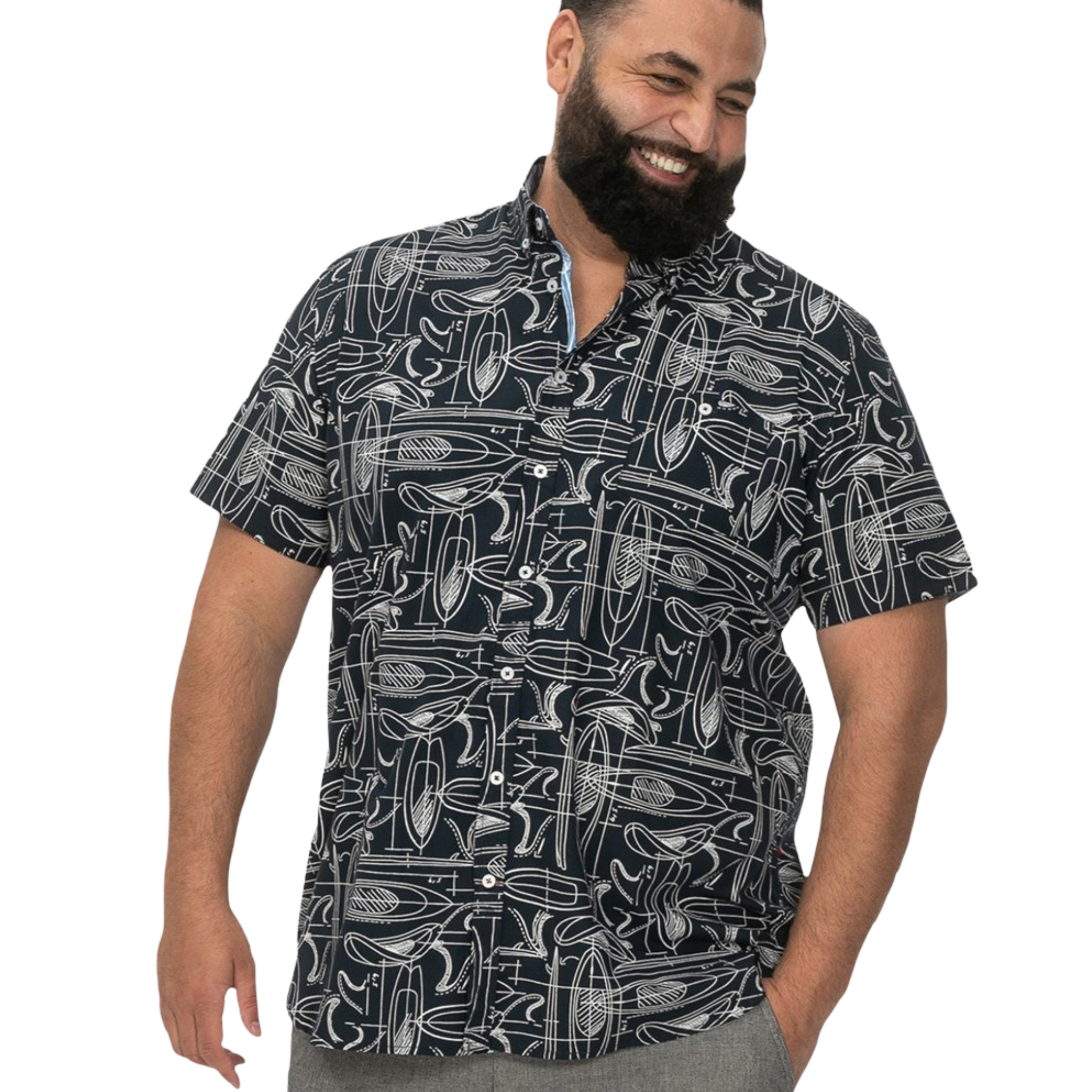 Man wearing a navy patterned shirt on a white background
