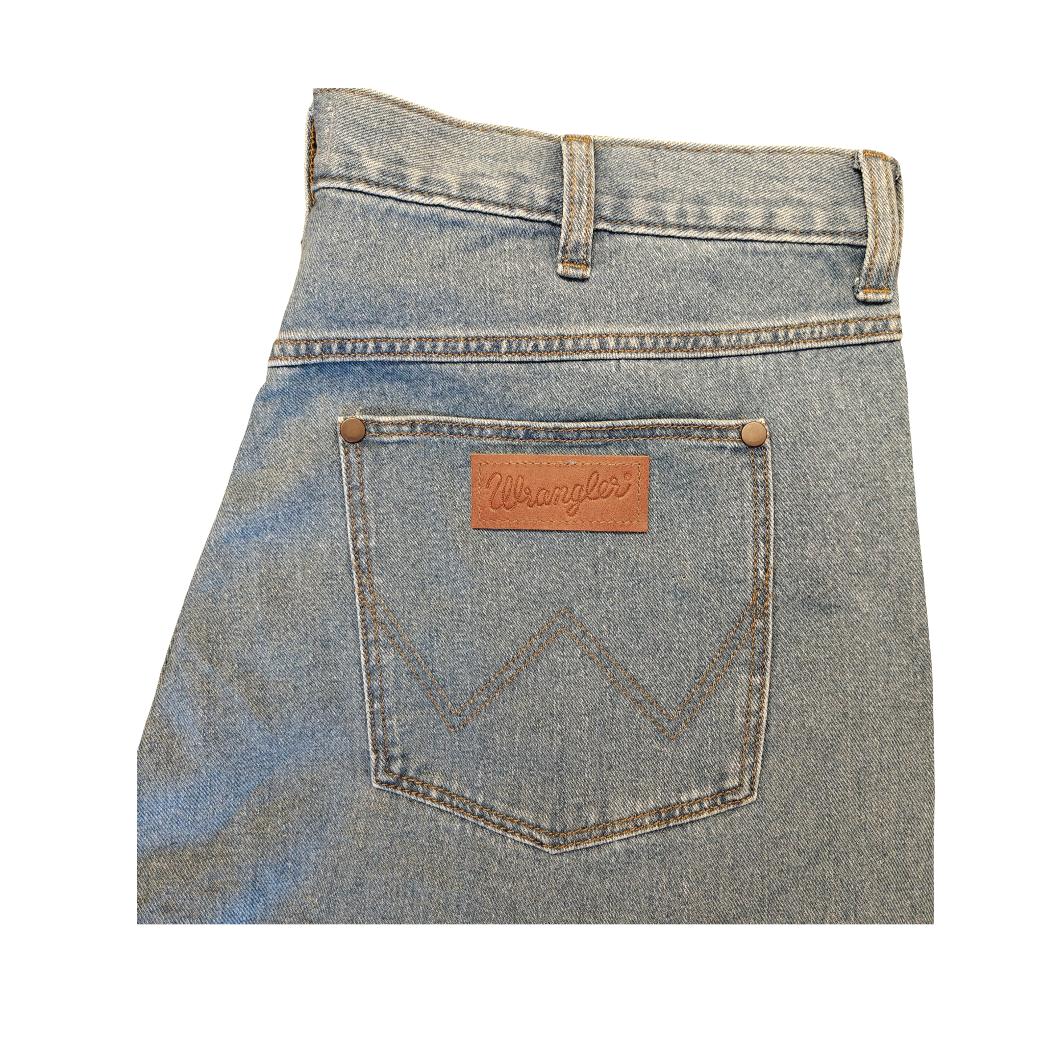 Back pocket of a blue denim jeans with Wrangler logo on a white background